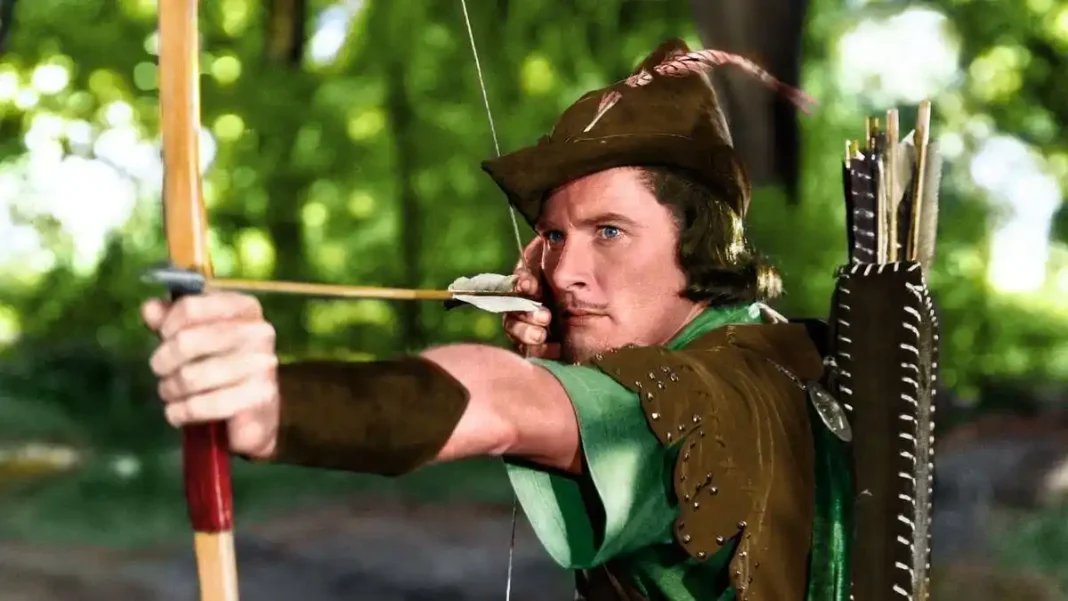 Errol Flynn apuntando con una flecha en un fotograma de la película Robin de los bosques (The Adventures of Robin Hood, 1938), de Michael Curtiz y William Keighley